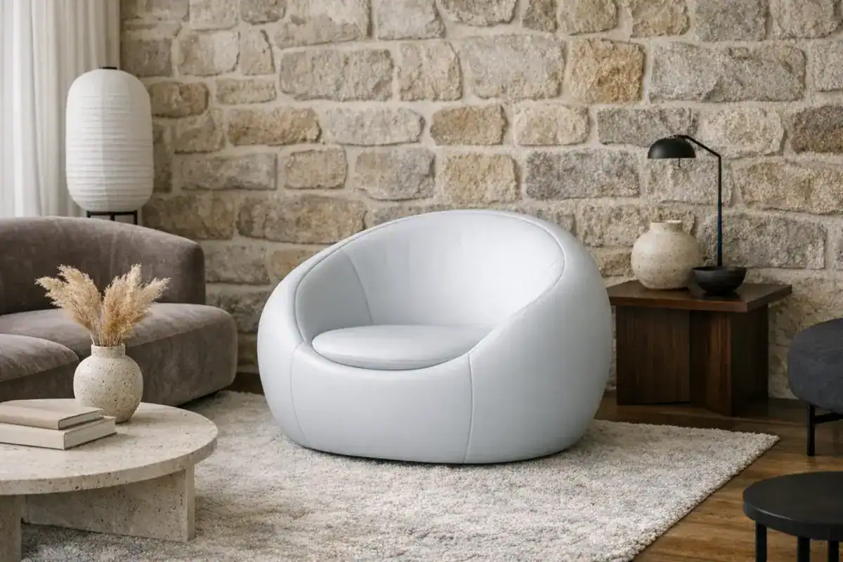 fauteuil cocon arrondi rembourré style rétro années 70 salon 2026 Ferm Living Kartell